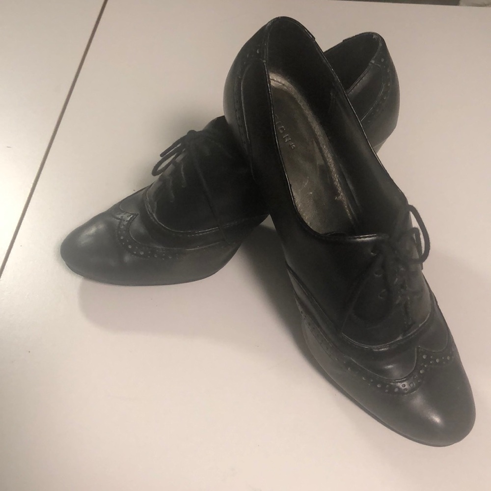 Black dress shoes with 3 inch heels with ties. Will look at all offers.